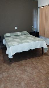 Łóżko lub łóżka w pokoju w obiekcie Los Ceibos
