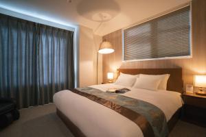 Voodi või voodid majutusasutuse 谷町君Hotel 京都駅東29 toas