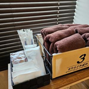 a couple of boxes of towels on a table at supiahouse in Tokyo