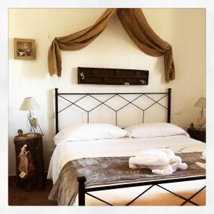 Postel nebo postele na pokoji v ubytování Le Tartarughe rooms