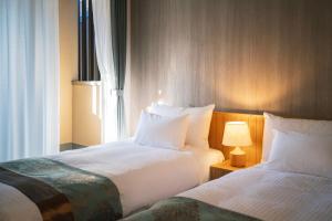 Voodi või voodid majutusasutuse 谷町君Hotel 京都駅東29 toas