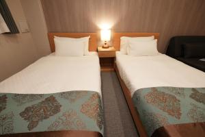 Voodi või voodid majutusasutuse 谷町君Hotel 京都駅東29 toas