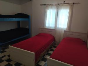 מיטה או מיטות בחדר ב-Los Talas Casa Con Pileta Tanti