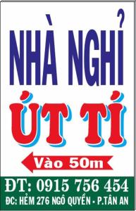 a sign for a new u try with at Nhà nghỉ Út Tí in Tân Tạo