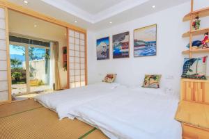 Dali Listening Seaview Villa大理听城海景别墅客房内的一张或多张床位