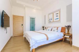 Dali Listening Seaview Villa大理听城海景别墅客房内的一张或多张床位
