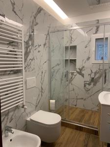 a bathroom with a shower and a toilet and a sink at CASA BASTIO in La Spezia +54 photos