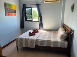 Postel nebo postele na pokoji v ubytování Guest House Blue Andaman