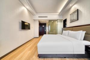 Cama o camas de una habitación en Yiwu International Mansion