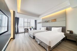 Katil atau katil-katil dalam bilik di Yiwu International Mansion