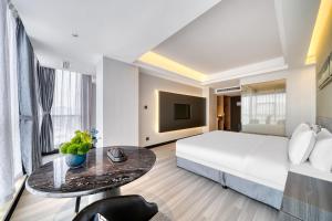Katil atau katil-katil dalam bilik di Yiwu International Mansion