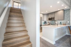 a staircase leading up to a kitchen and a house at Luxurious & Spacious Ocean Vistas in Wailea