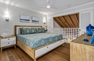 a bedroom with a bed and a window at Luxurious & Spacious Ocean Vistas in Wailea