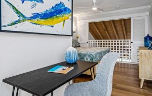 a dining room with a table and chairs at Luxurious & Spacious Ocean Vistas in Wailea