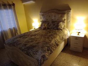 a bedroom with a bed with a teddy bear on it at Casa hermosa- full amueblada in Tegucigalpa