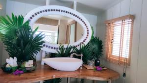 a bathroom with a sink and a large mirror at Koh Mook Sivalai Beach Resort in Ko Mook