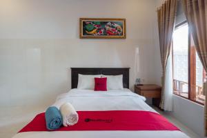 Letto o letti in una camera di RedDoorz Plus @ Singaraja