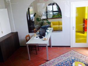 a room with a table with a laptop on it at Locanda Ai Due Orsi in Milan