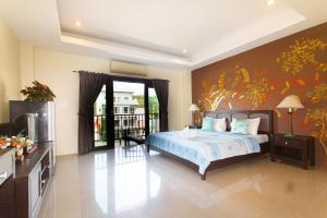 Postel nebo postele na pokoji v ubytování KRABI MORE HOTEL