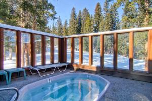 a screened in porch with a jacuzzi tub at Tyra I A2D in Breckenridge