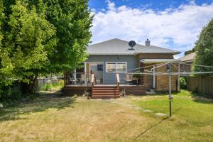 a small blue house with a fence and a yard at Bluestone Cottage - Character & Class in Orange