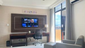 TV a/nebo společenská místnost v ubytování Flat Manaus Hotéis Millenniun