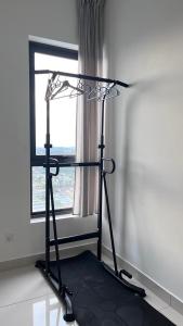 a room with a hair dryer in front of a window at Fully furnished Studio Unit. in Sungai Buluh