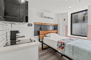 Postel nebo postele na pokoji v ubytování Goodseed Suites Philadephia Center