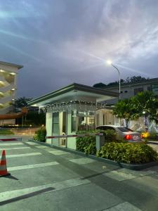 a building with a traffic cone in a parking lot at Condotel - Minimalistic 2 minutes walk to SM Marilao in Marilao
