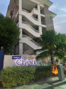 a building with a sign in front of it at Condotel - Minimalistic 2 minutes walk to SM Marilao in Marilao