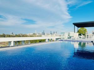 a large swimming pool on top of a building at Cityscape Oasis Homes at Toowong Precinct in Brisbane