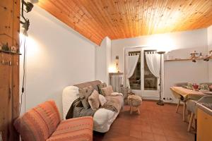 a living room with a couch and a table at Chaberton Romantic Retreat - Happy Rentals in Claviere