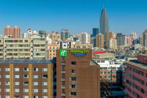 a view of a city with a hudlin express sign on a building at Holiday Inn Express Lanzhou Zhengning Road, an IHG Hotel in Lanzhou