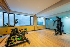 a gym with a treadmill and a bike in a room at Holiday Inn Express Lanzhou Zhengning Road, an IHG Hotel in Lanzhou
