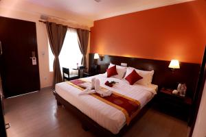 Katil atau katil-katil dalam bilik di Hotel Eco Tree Pokhara