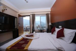 Katil atau katil-katil dalam bilik di Hotel Eco Tree Pokhara