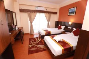 Katil atau katil-katil dalam bilik di Hotel Eco Tree Pokhara