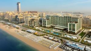 an aerial view of a city with a beach and buildings at Marriott Resort Palm Jumeirah, Dubai in Dubai