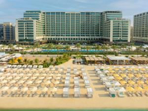 an aerial view of a resort with umbrellas and a beach at Marriott Resort Palm Jumeirah, Dubai in Dubai