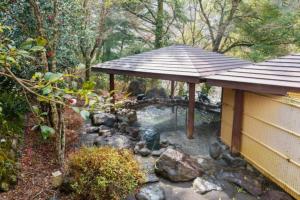 a garden with a gazebo and a pond at Mori no Kuni - Vacation STAY 03790v in Ōma