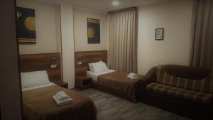 Postelja oz. postelje v sobi nastanitve Hotel Georgian