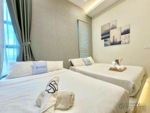 Postel nebo postele na pokoji v ubytování Melaka Ong Kim Wee Residences by Stayrene