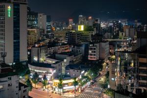 a view of a city at night at Urbanstay Myeongdong in Seoul