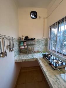 Kuchyň nebo kuchyňský kout v ubytování The Divine Abode Homestay 1