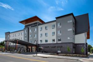 a rendering of a hotel on a street at TownePlace Suites by Marriott Loveland Fort Collins in Loveland