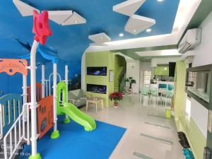 TV a/nebo společenská místnost v ubytování Fish Nest Villa 宜蘭親子包棟民宿 戲水池 歡唱 代訂晚餐