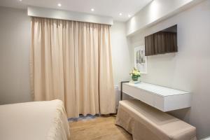 TV a/nebo společenská místnost v ubytování Aelia Luxury Apartments