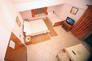 Een bed of bedden in een kamer bij Hotel Primavera