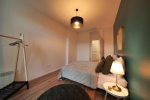 Letto o letti in una camera di Royal Square View Residence