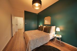 Letto o letti in una camera di Royal Square View Residence